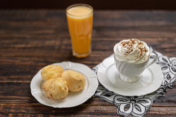 Brazilian snack cheese bread, Homemade cheese buns in rustic style, vintage wooden background