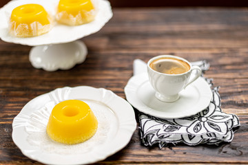 A brazilian dessert made with eggs and coconut. Quindim on wooden background