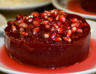 Ayva Tatlisi, Quince in Syrup, Topped with Nuts and Cream Cheese. Traditional Turkish Dessert.