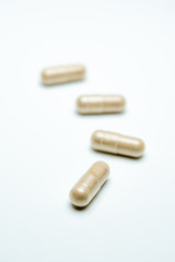 Pills over white background.