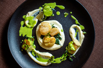Scallops with potato purée and green sauce