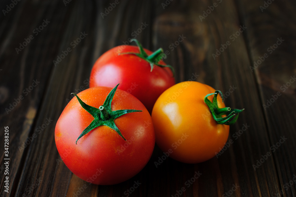 Wall mural tomatoes on a wooden table