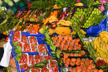 Fresh and organic fruits at farmers market. Colorful and varied mix of legumes, veggie and fruits