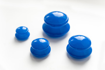 Silicone vacuum jars, banks for massage, anticellulite, face fitness, blue, on a white background