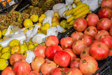 Fresh and organic fruits at farmers market. Colorful and varied mix of legumes, veggie and fruits
