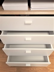 Empty Opened White Cabinet Drawers