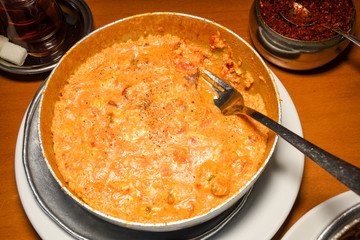 Traditional turkish food breakfast dish menemen made by eggs and tomatoes and different fillings
