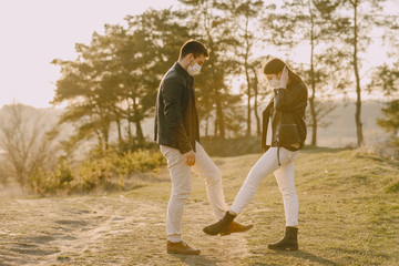 People in a spring foreat. Persons in a masks. Coronavirus theme.