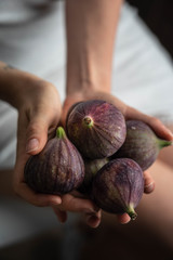 fresh figs on a palm hand
