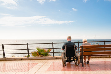 disabled person on a wheelchair on a sea vacation