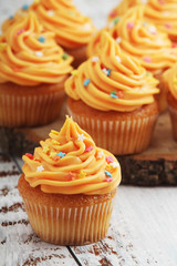 Cupcakes with orange icing on top