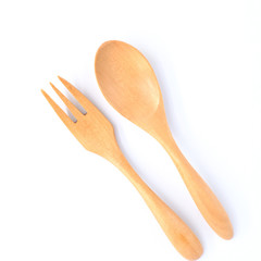 Top view bright wooden spoon and fork isolated on white background with Clipping path, the concept of cooking.