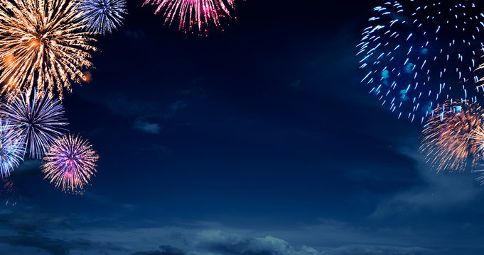 night sky with fireworks , new years background.