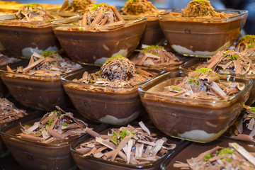 Fototapeta premium Chocolate mousse pudding in portion glasses on stack one over another