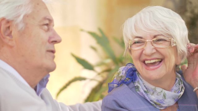 Beautiful seniors couple having fun outside