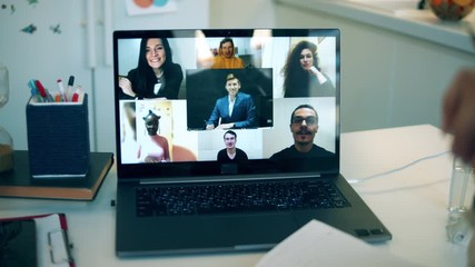 Businesswoman works from home, talking via laptop during quarantine. Woman using video conferencing technology during covid-19 lockdown. - Powered by Adobe