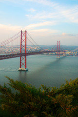 View of 25th of April Bridge, a suspension bridge connecting the city of Lisbon, capital of Portugal, to the municipality of Almada on the left (south) bank of the Tagus river. Lisbon, Portugal