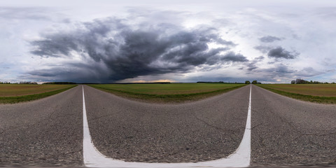 full seamless spherical hdr panorama 360 degrees angle view on asphalt road among fields in evening...