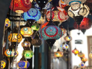 beautiful colourful arabic lamps shining in medina close up/ granada spain