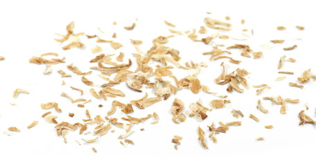 Dried Minced Onions on a White Background. Onion flakes isolated on white background.