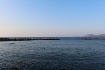 Obraz premium Blue Mediterranean sea horizon in a sunny day in Chania, Crete Island, Greece.