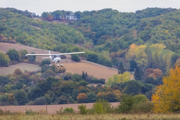 Naklejka premium Airplane landing at small airport