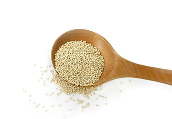 Organic Quinoa (Chenopodium quinoa) seeds in a wooden spoon isolated. quinoa seeds isolated on white background.