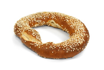 tasty bagel with sesame seed on white background