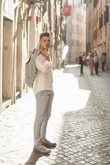 Nice boy posing in Rome during a sunny day untile the sunset