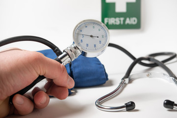 Device for blood pressure and medical stethoscope and Sphygmomanometer in the background on white
