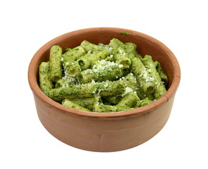 Italian Food. Pasta with original pesto green sauce in Genoa (Genova) Italy on white plate background, Pasta with basil pesto herbs background.