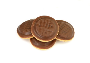 Chocolate coated biscuit cakes with the orange filling isolated over the white background.
