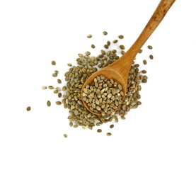 Hemp seeds in a wooden spoon isolated on white background. Super food hemp seed.