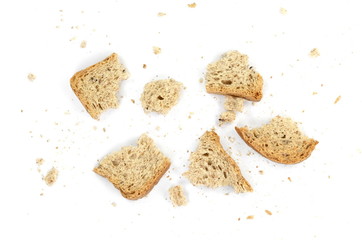 Bread crumbs, wholemeal bread isolated on a white background. leftover bread.