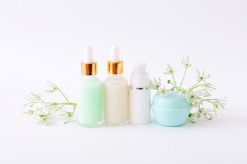 Natural cosmetic skincare bottle containers on white background. Natural beauty