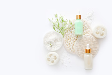 Top view of cosmetic products with natural ingredients on white background for natural beauty. Beauty spa background