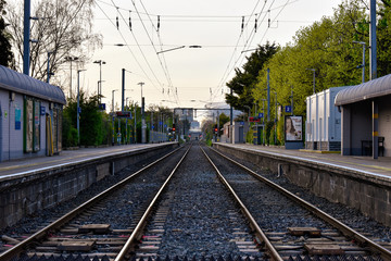 A  view of empty railway tracks from a train station. Concept for delayed, reduced or cancelled transport services