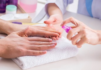 Hands during manicure care session