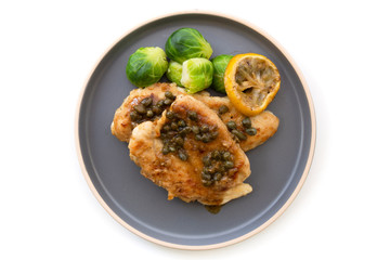 Italian food Lemon chicken Piccata  with Brussels Sprouts