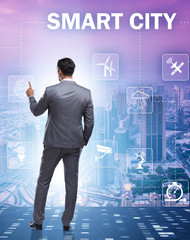 Concept of smart city with businessman pressing buttons