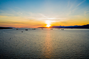 Aerial of Anchored Ships at the Coast During Golden Hour Sunset