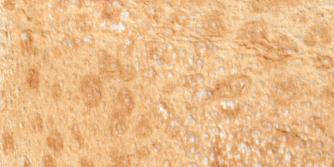 Texture of thin traditional freshly baked homemade italian bread. Close-up pita bread as a textured bread background.