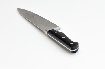 stainless steal kitchen knife on white table 

