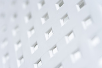 White texture from a plastic basket lattice.