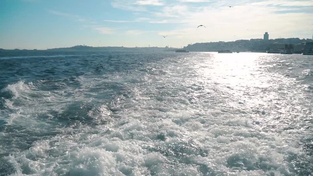 ISTANBUL, TURKEY, May 23rd 2018: Beautiful texture of the foam wave splash caused by a ship on the surface of the Bosphorus.