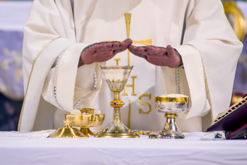chalice with wine, blood of christ, and pyx with bread, body of christ, ready for the communion of the faithful