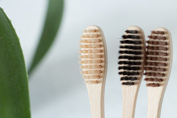 wooden toothbrush in a glass