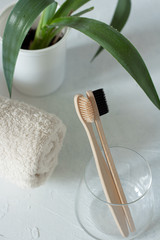 wooden toothbrush in a glass