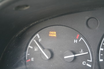 Gas Gauge, Check Engine Light, Thermometer on a Dashboard