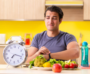 Young man in dieting and healthy eating concept